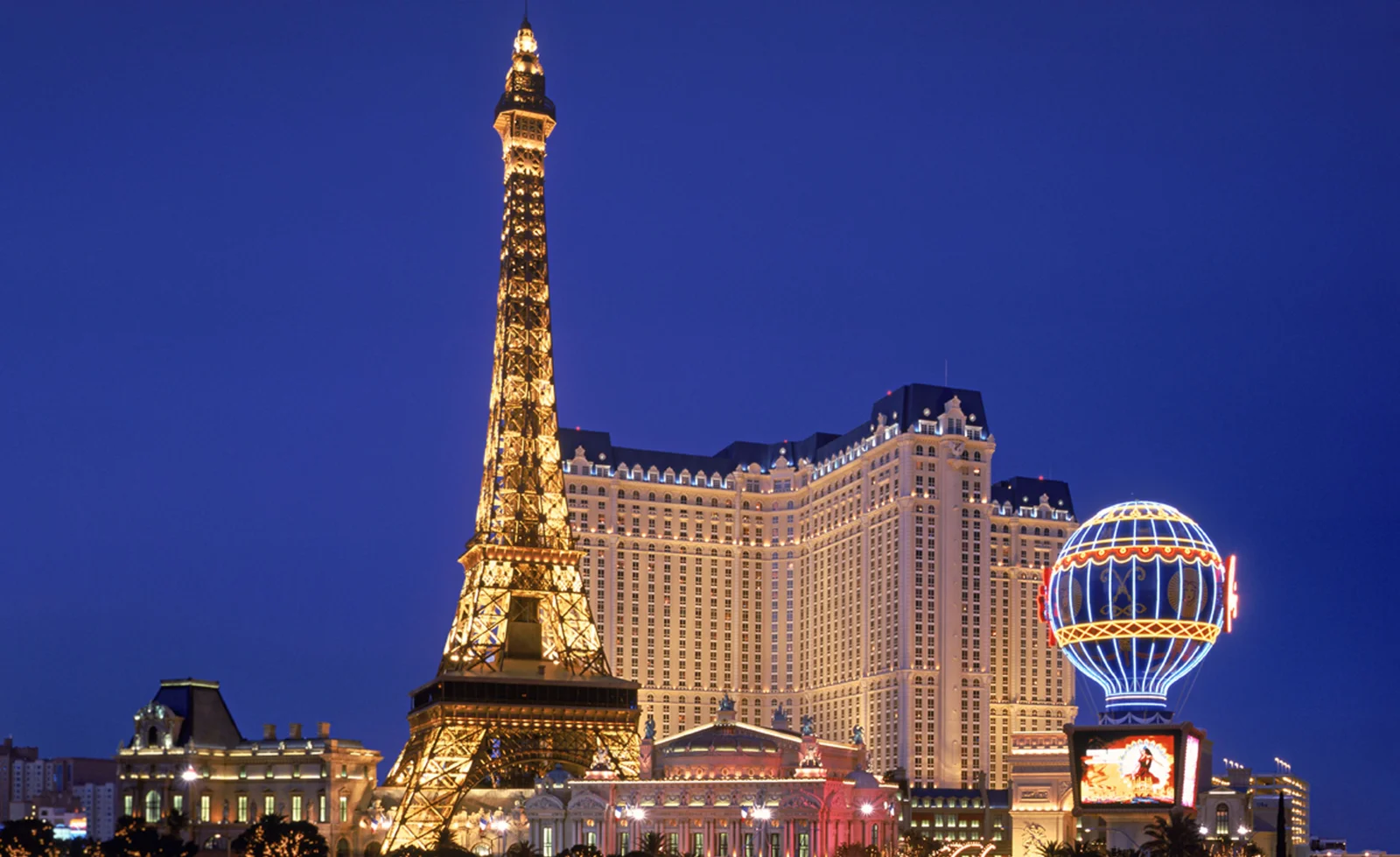 Paris Las Vegas and Eiffel Tower replica at night